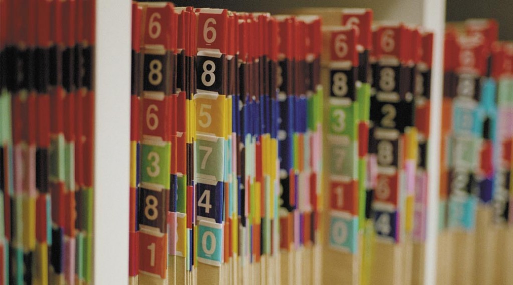 Medical records folders on a shelf