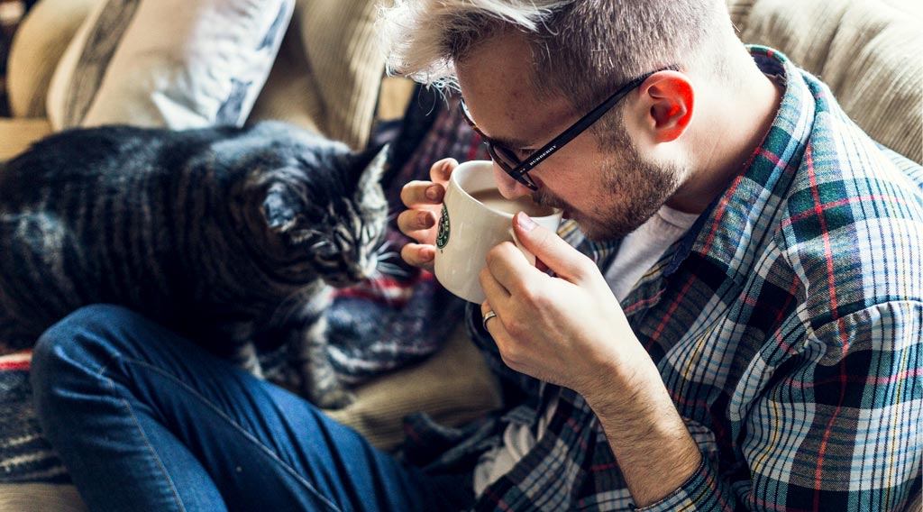 Man on sofa with cat