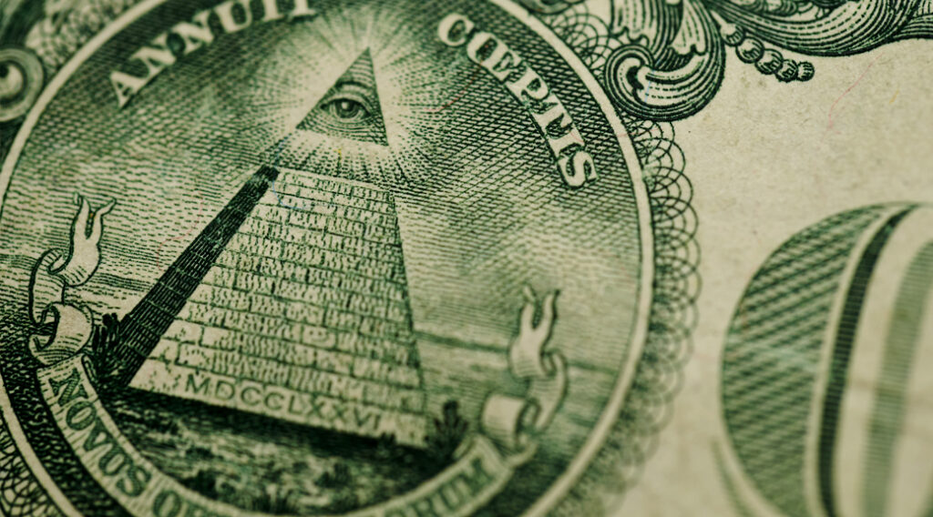 Close-up of pyramid emblem on the back of US currency