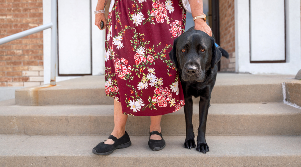 ICAN client and her mobility assistance dog